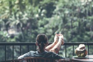 relaxation woman with legs up on porch